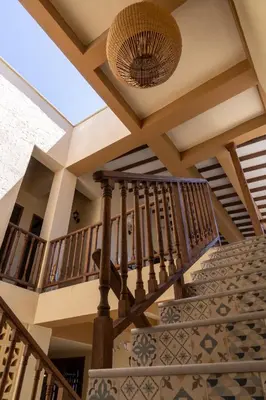 a staircase in a house with a vaulted ceiling at Hotel Boutique Lomas Colonial in Santa Fe de Antioquia