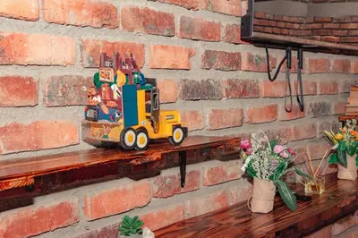 a toy truck sitting on a shelf next to a brick wall at Don Café - Luxury and confort in Manizales