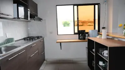 a kitchen with a sink and a window in it at Hogar De Ensueño in Envigado