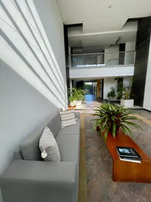 a living room with a couch and a table at aparta hotel campestre luxury en llanogrande 10 minutos aeropuerto in Rionegro