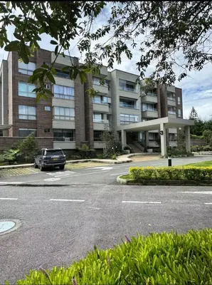 a car parked in front of a large building at aparta hotel campestre luxury en llanogrande 10 minutos aeropuerto in Rionegro