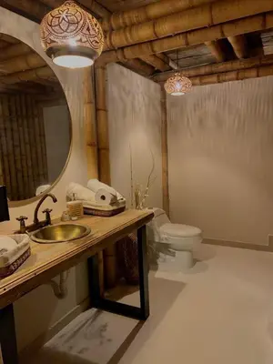 a bathroom with a sink and a toilet at Leaf House - Sereno Glamping in El Tablazo