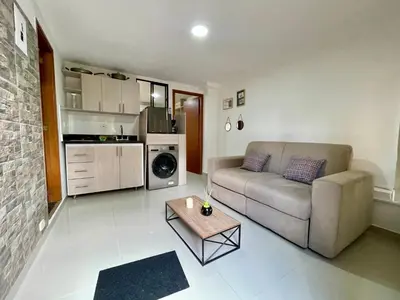 a living room with a couch and a table at laureles zona turistica estadio cerca poblado aire acondicionado in Medellín