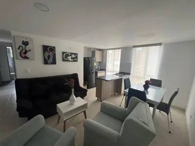 a living room with a couch and chairs and a table at Espectacular apartamento in Manizales