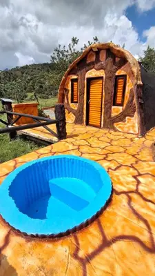 a large blue frisbee in front of a house at Hotel Pekin in San Carlos