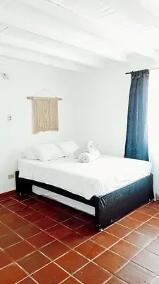 a bedroom with a bed in a room at Hotel Pekin in San Carlos