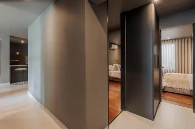 a sliding door in a room with a bedroom at 10th Street Three-Bedroom Jacuzzi & Billiard 201 in Medellín