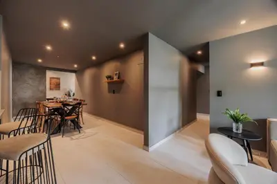a dining room with a table and chairs at 10th Street Three-Bedroom Jacuzzi & Billiard 201 in Medellín