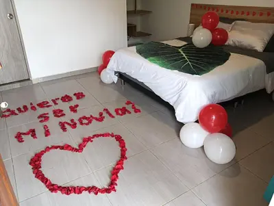 a bedroom with a bed with a heart and balloons at VIVE PARADISE - UNICA HOSTERIA TERMAL Only Adult a solo 15 minutos de la ciudad in Medellín