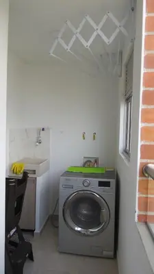 a washing machine in a bathroom with a sink at Acogedor apto in Sabaneta