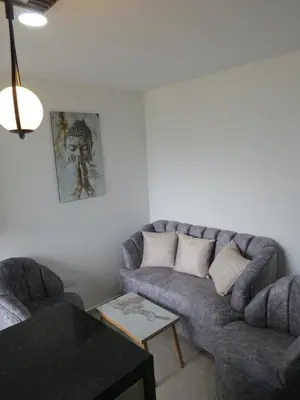 a living room with a couch and a table at Acogedor apto in Sabaneta