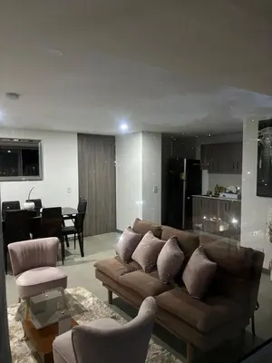a living room with a couch and a dining room at Apartamento Moderno con piscina en Medellín Itagüí - sur in Estación El Salto