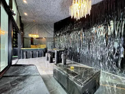 a lobby with a wall with a water fountain at Luxury Villa Eleven Eleven in San Rafael