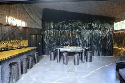 a restaurant with a table and stools in a room at Luxury Villa Eleven Eleven in San Rafael