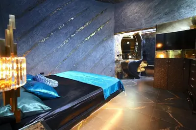 a bedroom with a bed and a tv in a room at Luxury Villa Eleven Eleven in San Rafael