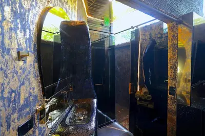 a dirty bathroom with a sink and a mirror at Luxury Villa Eleven Eleven in San Rafael