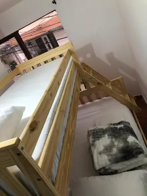 a pair of bunk beds in a room with a window at Apartamento funcional cerca a Parque de Bello Antioquia in Bello