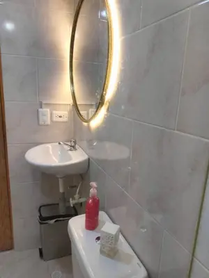a bathroom with a sink and a mirror at Tu espacio cómodo, elegante y céntrico con balcón 401 in Medellín