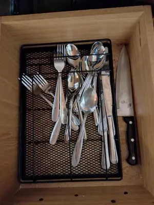 a drawer with silver utensils in a wooden box at Ambiente natural y amplio, con vista panorámica de Medellín 501 in Medellín