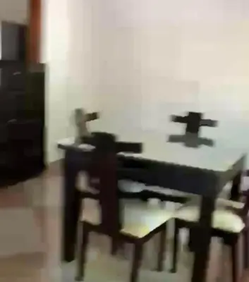 a table and chairs in a room at Casa MAVA in Mariquita