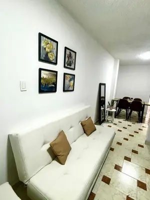 a white couch in a living room with a table at Apto 201 2H 2B Belén Fátima MUY bien ubicado in Medellín