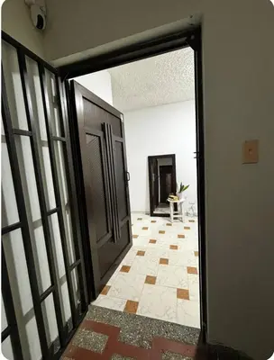 an open door to a room with a tile floor at Apto 201 2H 2B Belén Fátima MUY bien ubicado in Medellín