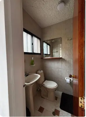 a bathroom with a toilet and a sink at Apto 201 2H 2B Belén Fátima MUY bien ubicado in Medellín