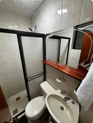 a small bathroom with a toilet and a sink at Apto 201 2H 2B Belén Fátima MUY bien ubicado in Medellín