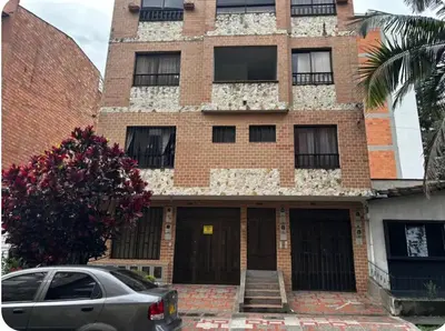 a building with a car parked in front of it at Apto 201 2H 2B Belén Fátima MUY bien ubicado in Medellín