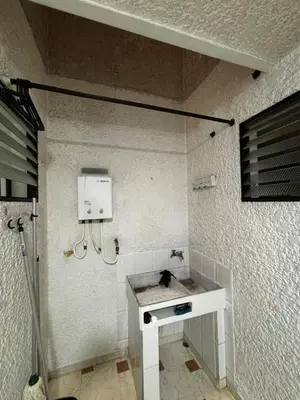 a bathroom with a sink and a phone on the wall at Apto 201 2H 2B Belén Fátima MUY bien ubicado in Medellín