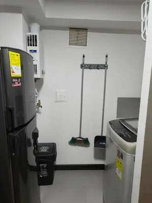 a kitchen with a refrigerator and a trash can at Apartamento cerca Terminal de Transportes y Cable aéreo in Manizales