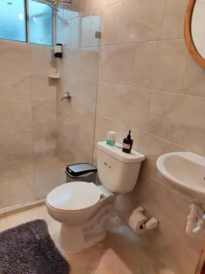 a bathroom with a toilet and a sink at Inspirado en Bali con espectacular vista 502 in Medellín