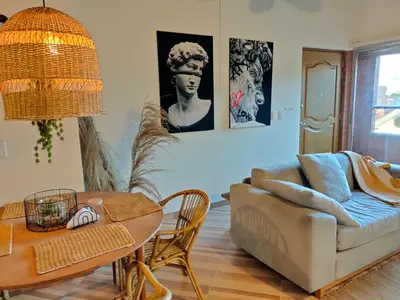 a living room with a couch and a table at Inspirado en Bali con espectacular vista 502 in Medellín