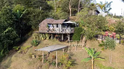a house sitting on top of a hill at Roots Eco House in Guatapé