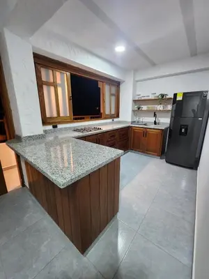 a large kitchen with a counter top and a refrigerator at Apartment in Tamesis in Támesis