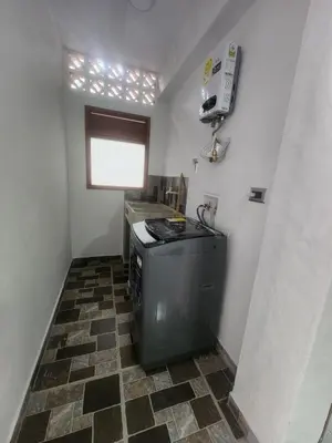 a small kitchen with a stove and a window at Apartment in Tamesis in Támesis