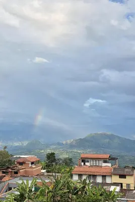 a group of buildings with mountains in the background at Apartment in Tamesis in Támesis
