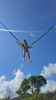 a man on a zip line in the sky at Cabaña con jacuzzi y piscina con agua de manantial in Norcasia