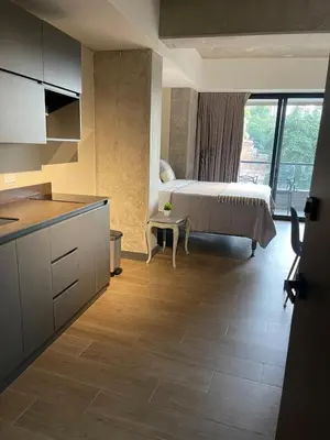 a kitchen with a bed in a room at Apartment with a balcony El Tesoro in Medellín
