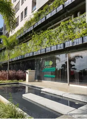 a building with a swimming pool in front of a building at Next to natural reserve, amazing views! in La Estrella