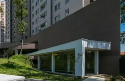 a large building with a building in a city at Next to natural reserve, amazing views! in La Estrella