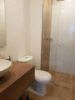 a bathroom with a toilet and a sink and a shower at Next to natural reserve, amazing views! in La Estrella