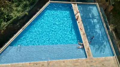 an overhead view of a large swimming pool at Next to natural reserve, amazing views! in La Estrella