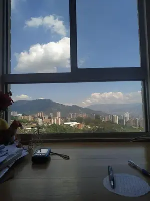 a large window with a view of a city at Next to natural reserve, amazing views! in La Estrella