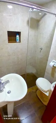 a bathroom with a sink and a toilet at COMODO APARTAMENTO WIFI-COWORK CERCA a ZONA TURISTICA DE MEDELLIN in Medellín