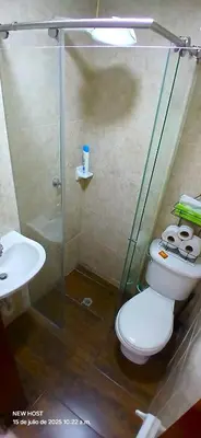 a bathroom with a shower and a toilet and a sink at COMODO APARTAMENTO WIFI-COWORK CERCA a ZONA TURISTICA DE MEDELLIN in Medellín