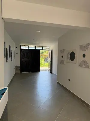 an empty room with a door and a tile floor at Primer piso con Garaje in Guatapé