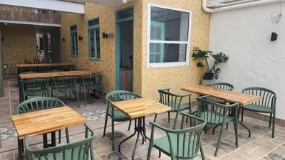 a row of tables and chairs at a restaurant at Paraíso Plaza - Hotel Boutique in Aguadas