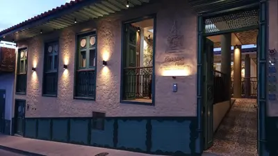 a building with a sign on the side of it at Paraíso Plaza - Hotel Boutique in Aguadas