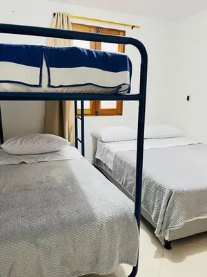 two bunk beds sitting next to each other in a room at Apartamento Luz De Luna in Jardin